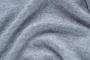sfondo in tessuto grigio lavorato a maglia foto