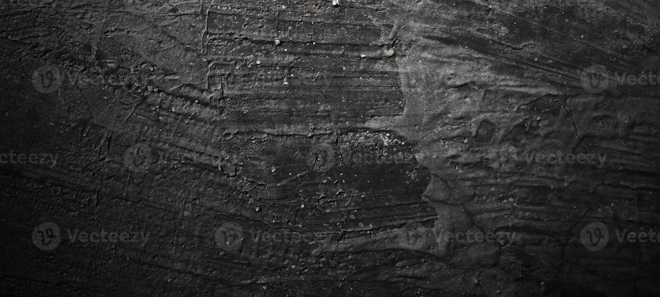 fundo de pedra preta escura. textura de concreto preto assustador. fundo da parede de pedra. foto