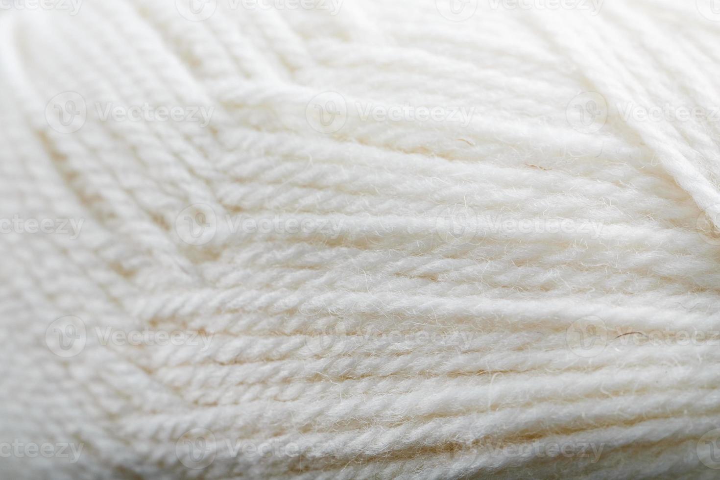 fios brancos de lã natural close-up em tela cheia foto
