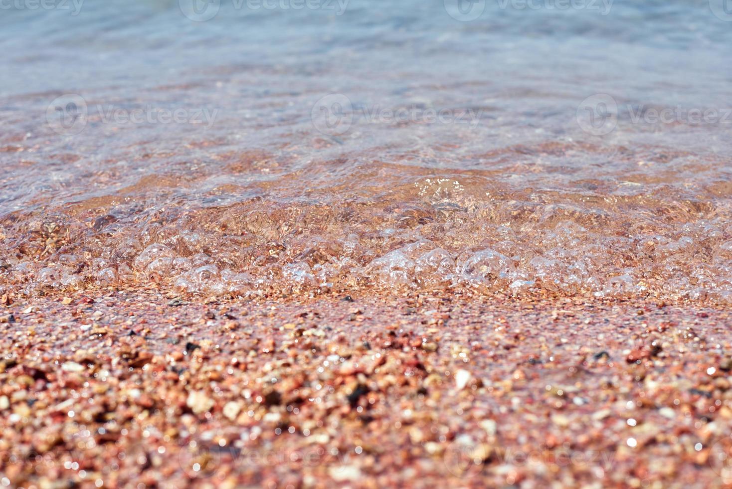 close-up da praia de areia do mar ou oceano como pano de fundo foto