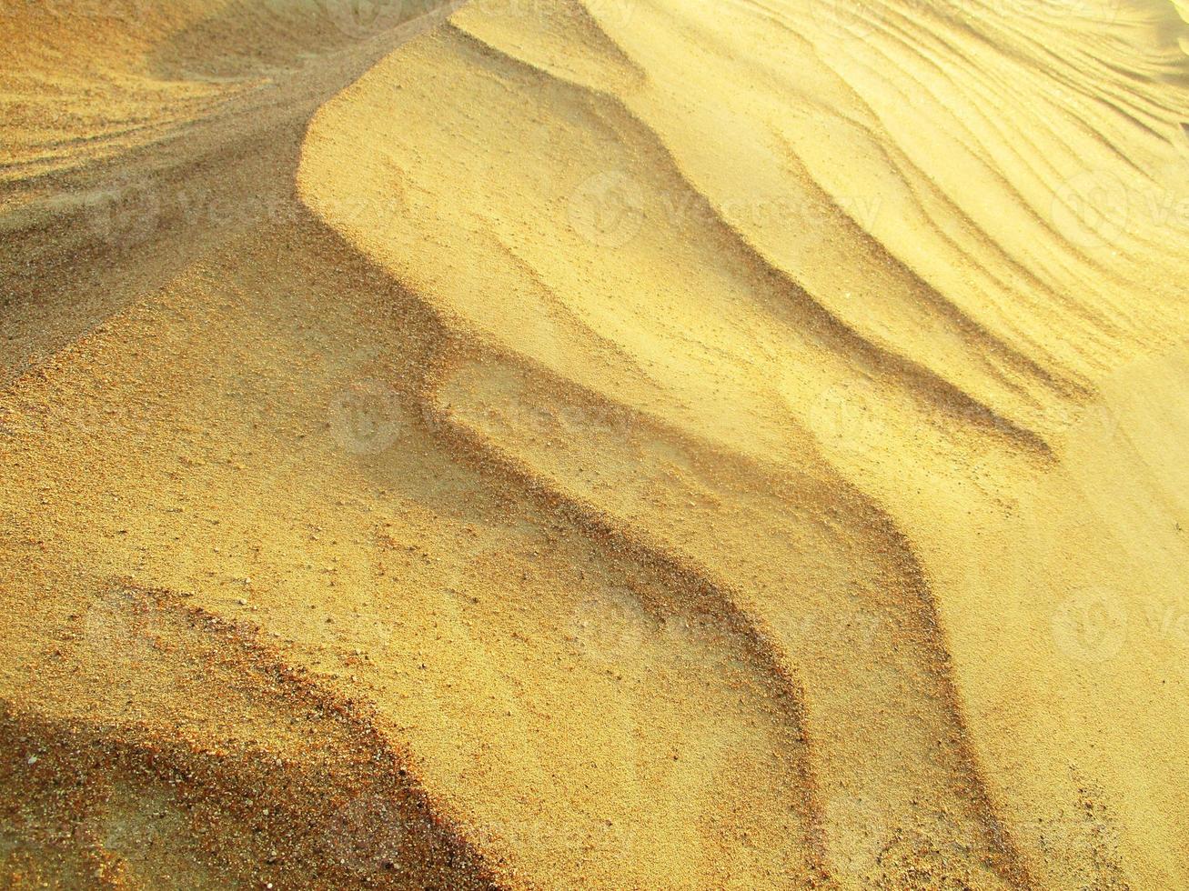 ondas de textura de areia. dunas do deserto. paisagem por do sol de dunas do deserto. foto