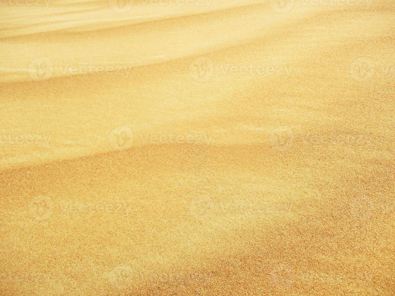 ondas de textura de areia. dunas do deserto. paisagem por do sol de dunas do deserto. foto