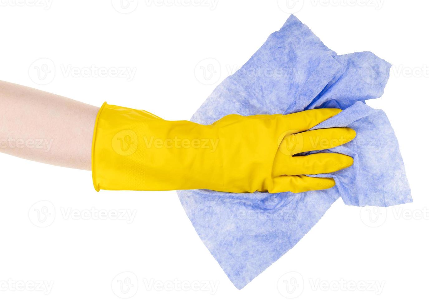 mão na luva amarela com recorte de pano azul amassado foto