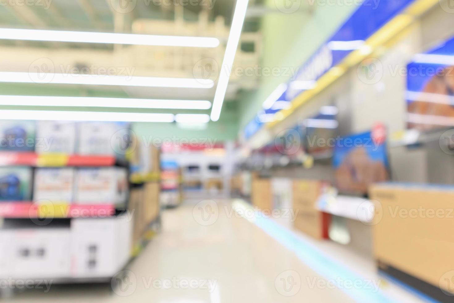 loja de departamentos eletrônicos mostra tv de televisão e eletrodomésticos com fundo desfocado luz bokeh foto