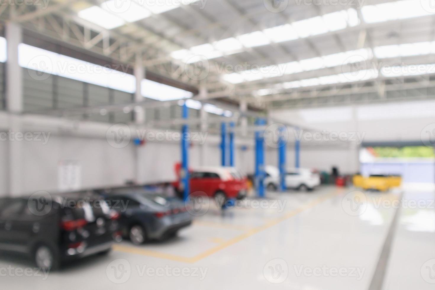 centro de serviço de carro com auto na estação de reparo bokeh luz desfocada fundo desfocado foto