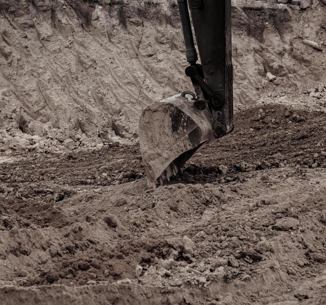 canteiro de obras de trabalho de retroescavadeira. foto