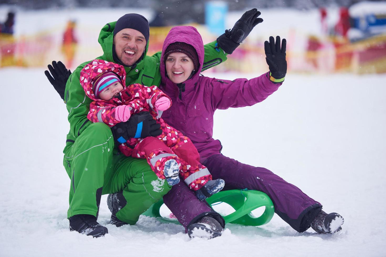 família na neve foto