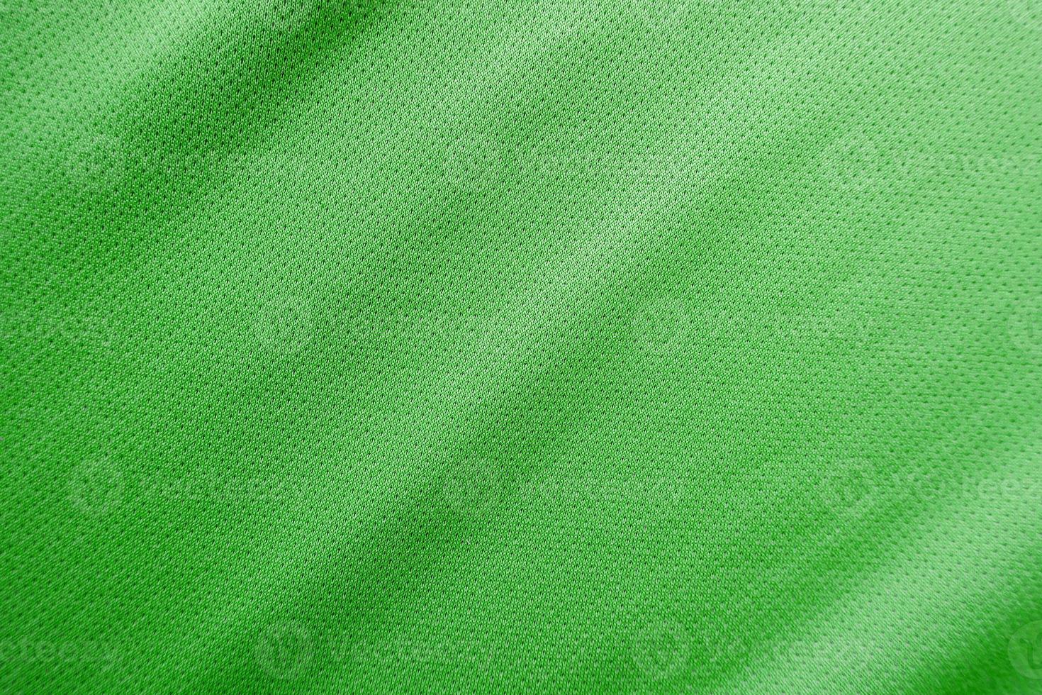 textura de jersey de tecido de roupas esportivas verdes foto