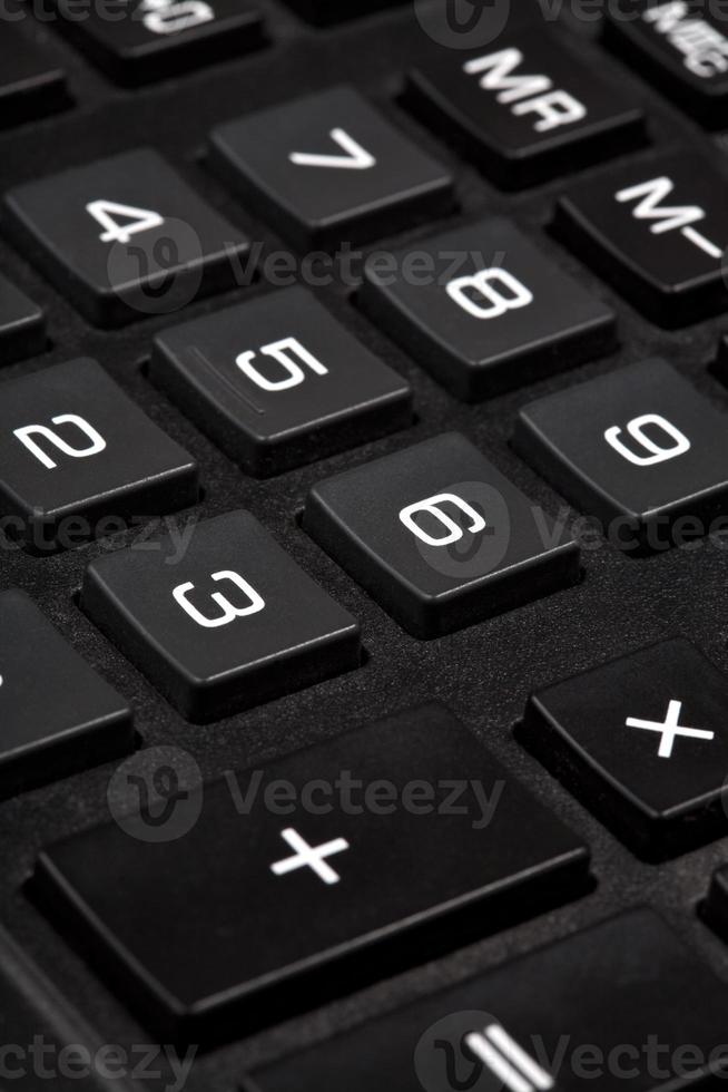 teclas de dígitos da calculadora preta close-up foto
