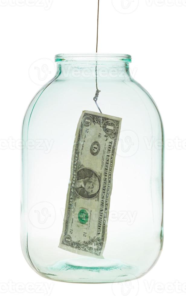 pegando o último dólar do frasco de vidro foto