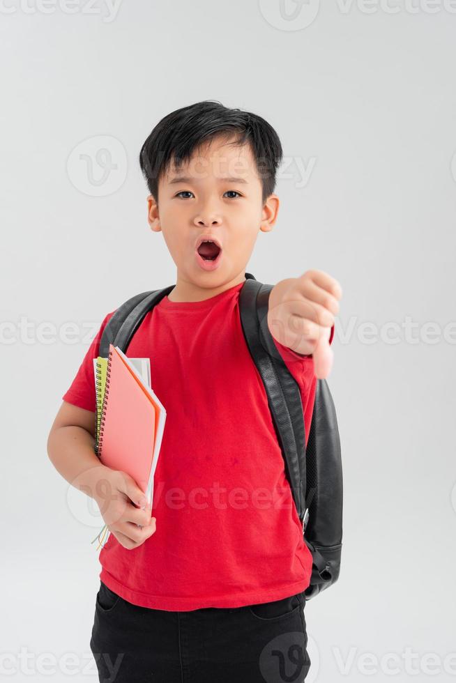 Foto de Jovem Chinesa Sobre A Parede De Tijolos Segurando O Disco Rígido  Com Cara Feia O Sinal Negativo Mostrando Desagrado Com Os Polegares Para  Baixo O Conceito De Rejeição e mais