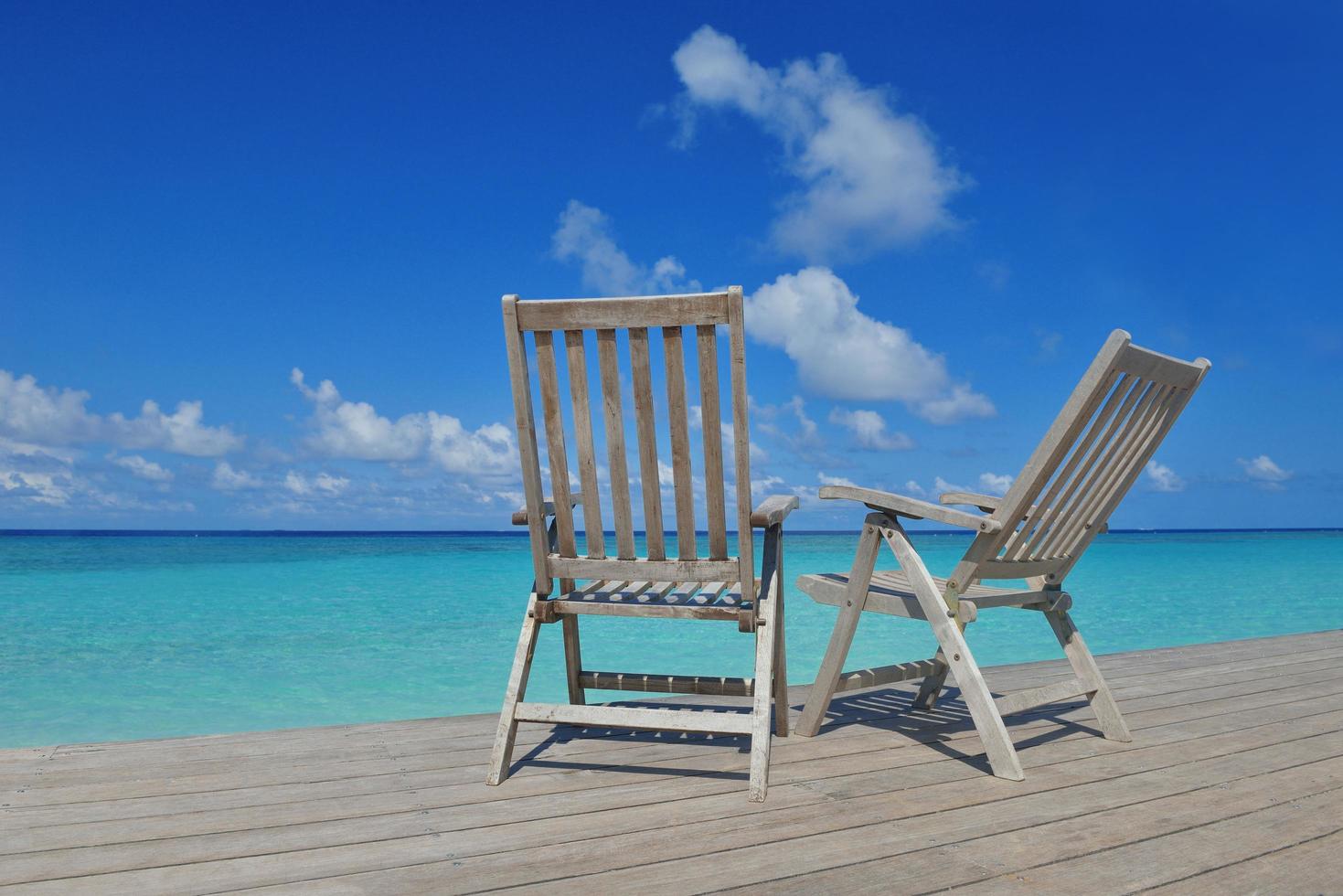 cadeiras de praia tropicais foto