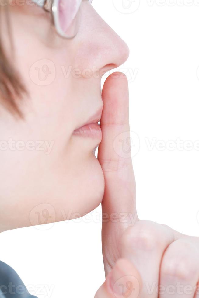 dedo indicador perto dos lábios - gesto de mão silêncio foto