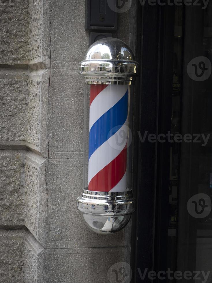 barbearia sinal vermelho branco e azul foto