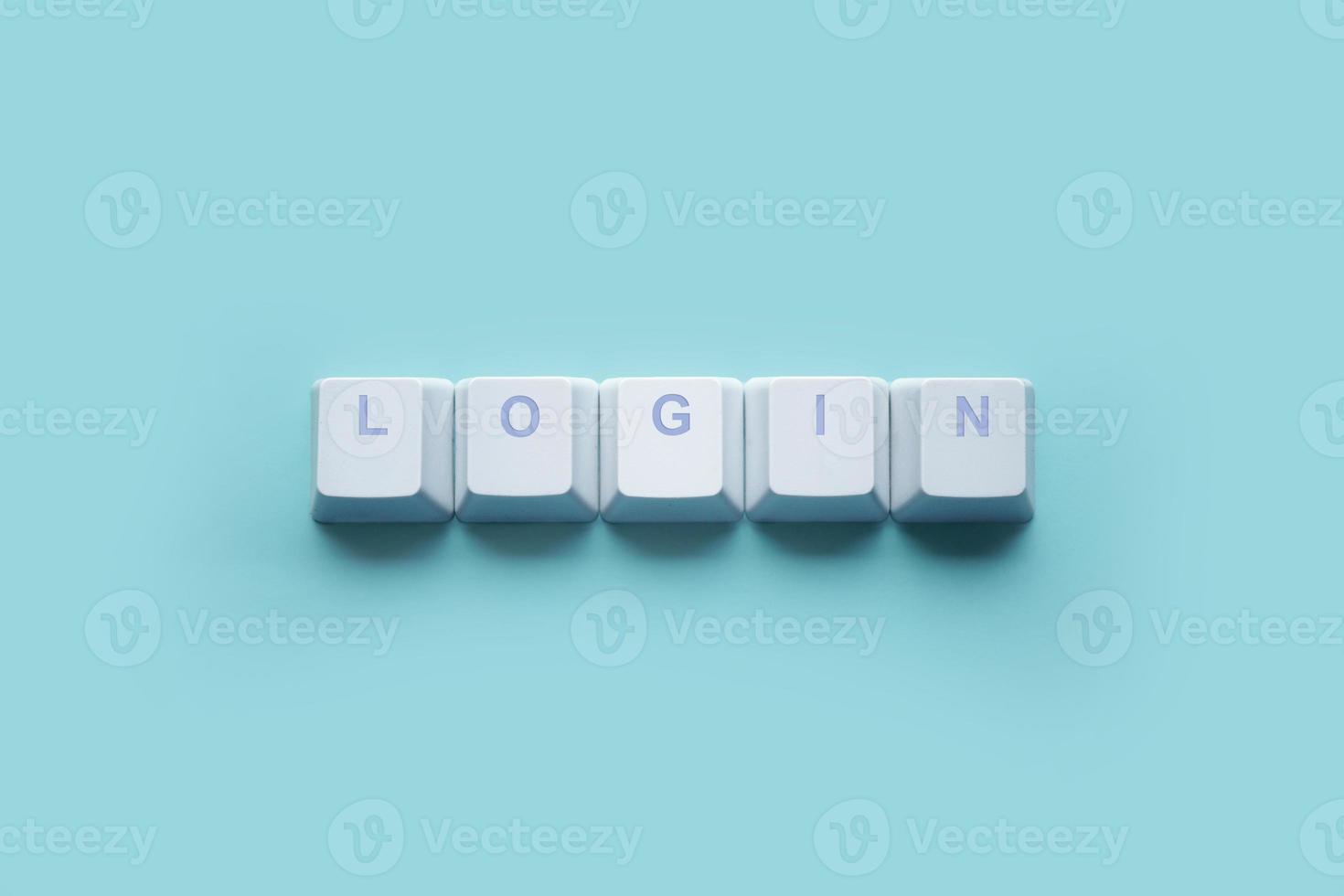 palavra login escrito nas teclas do teclado do computador isoladas em uma turquesa foto