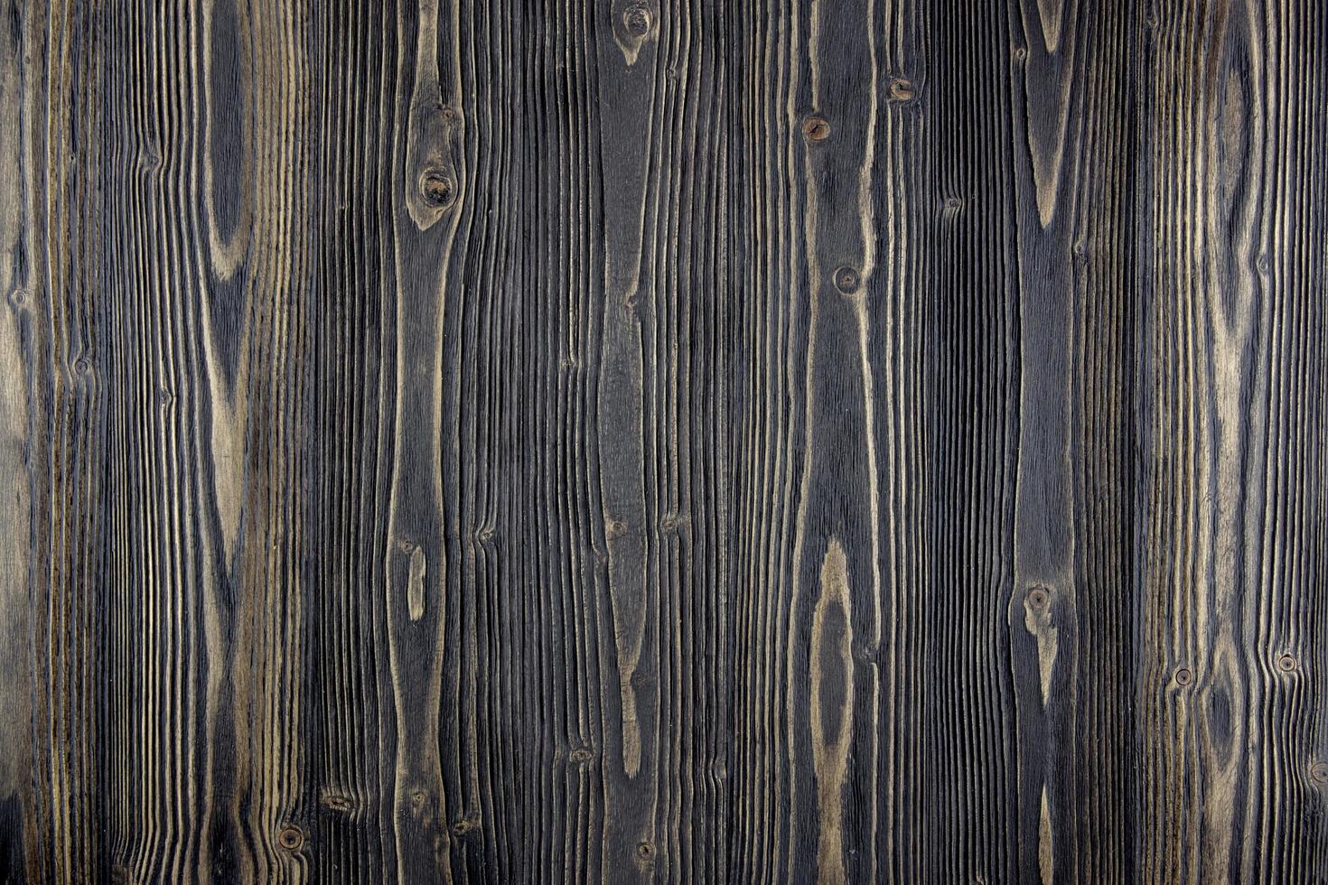 superfície da mesa de madeira escura foto