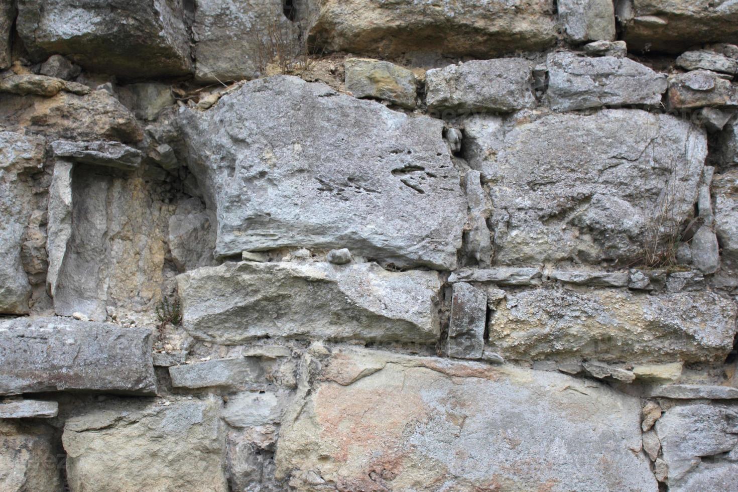 textura de fundo arquitetônico de parede de tijolos antigos foto