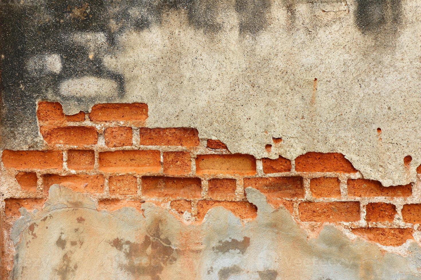 fundo de parede de tijolo vintage de concreto rachado foto
