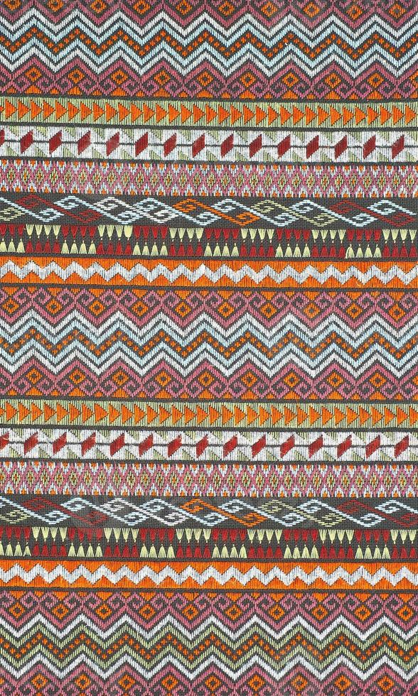 superfície do tapete colorido estilo peruano tailandês close-up. foto