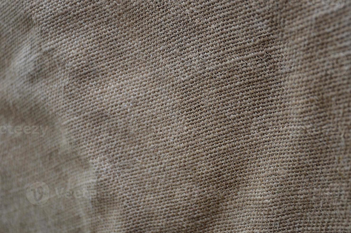 a textura de um pano de saco marrom muito velho. textura retrô com material de lona. imagem de fundo com espaço de cópia foto