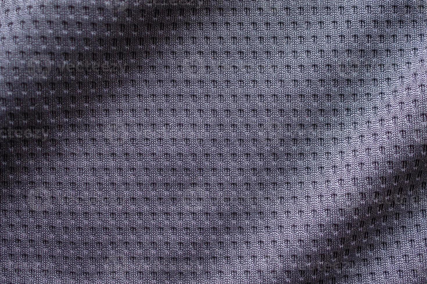 tecido cinza roupa esporte camisa de futebol com fundo de textura de malha de ar foto