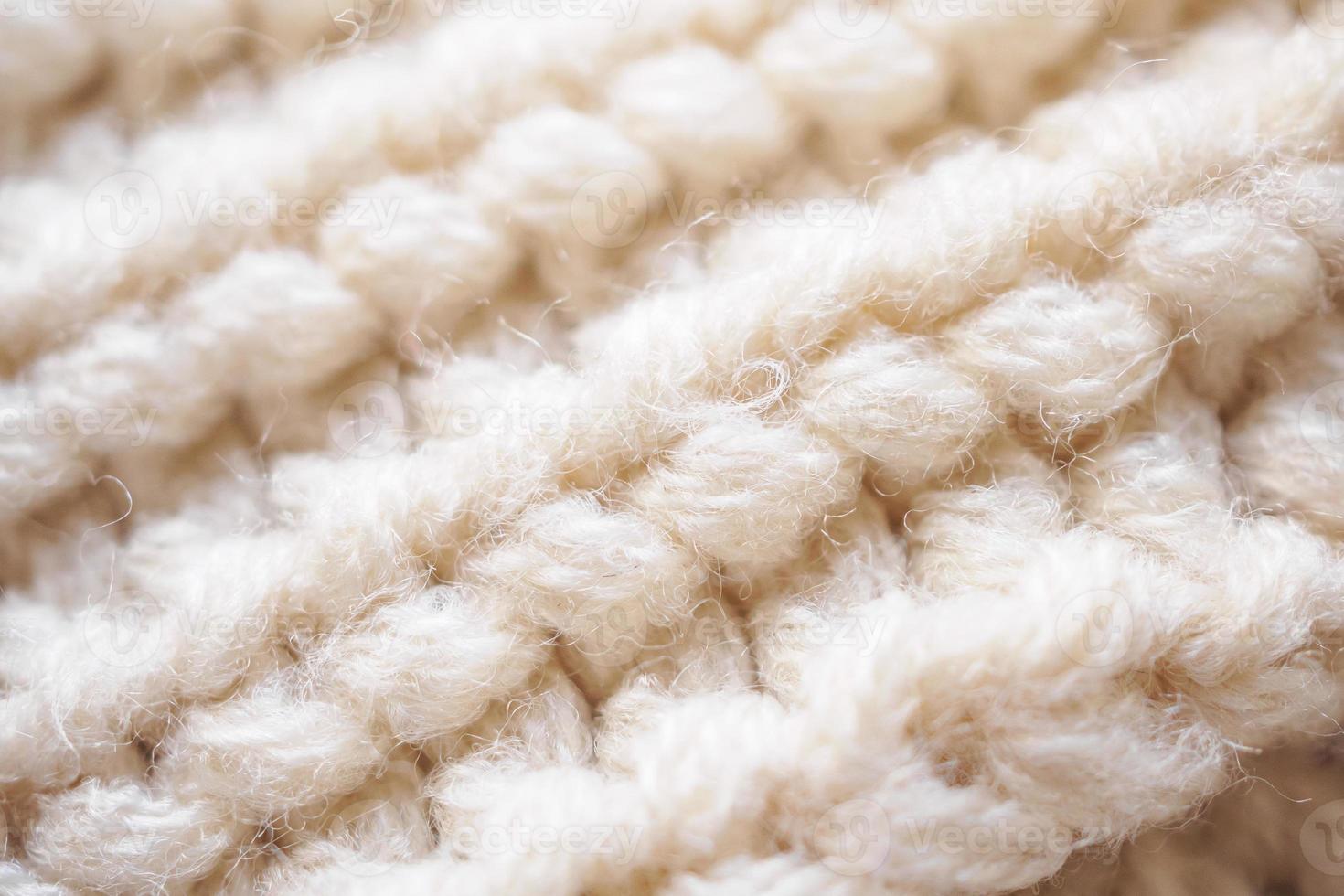 fundo de textura de tecido de lã de malha bege closeup foto