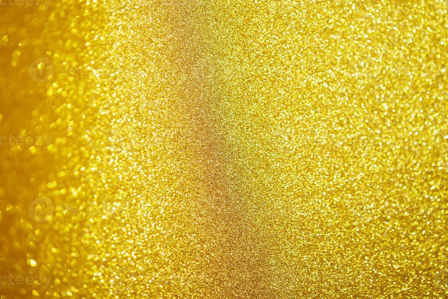 brilho de glitter dourado abstrato com fundo claro de bokeh foto