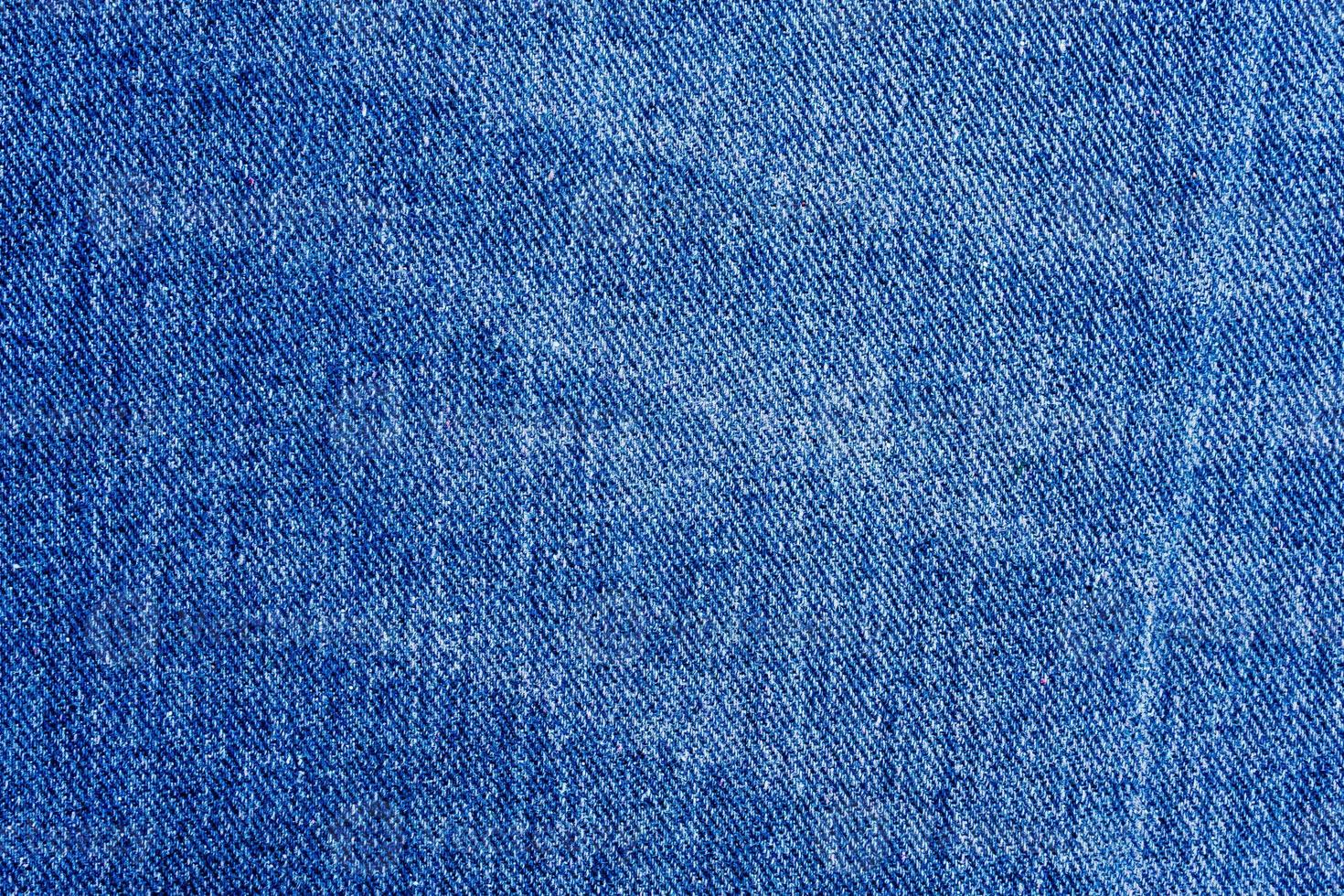 textura de jeans azul close-up vista superior do fundo foto