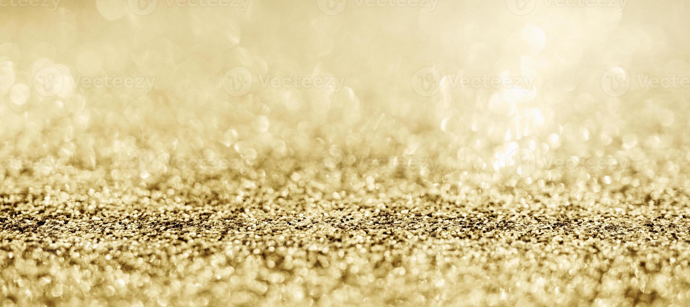 brilho de glitter dourado abstrato com fundo bokeh foto