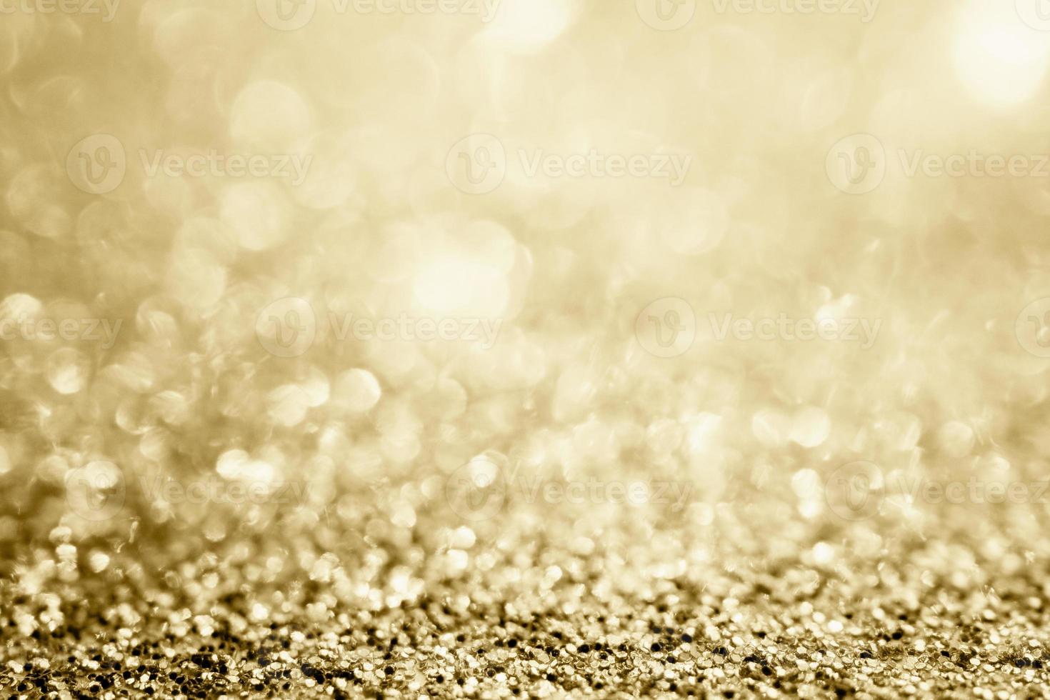 brilho de glitter dourado abstrato turva com fundo bokeh foto