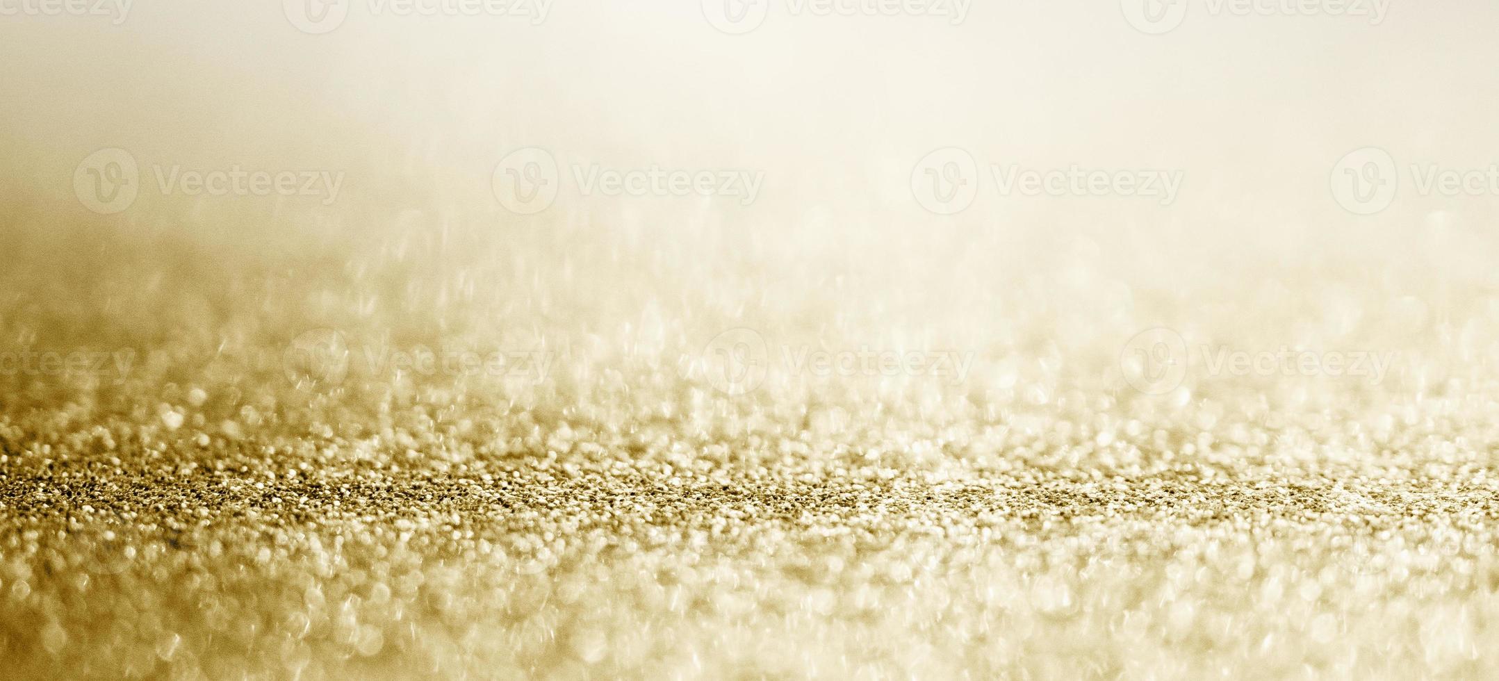 brilho de glitter dourado abstrato com fundo bokeh foto