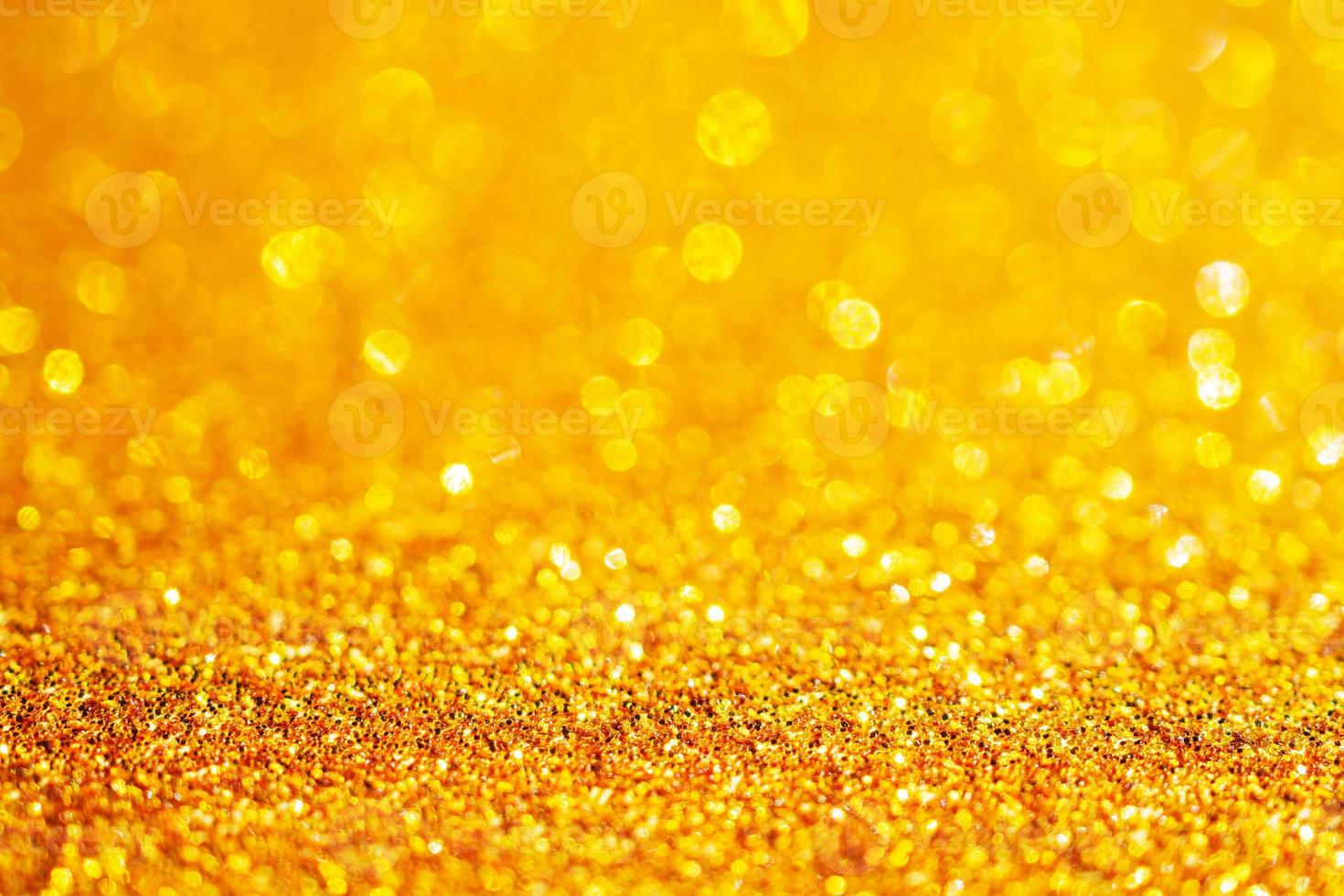 brilho de glitter dourado com fundo bokeh foto