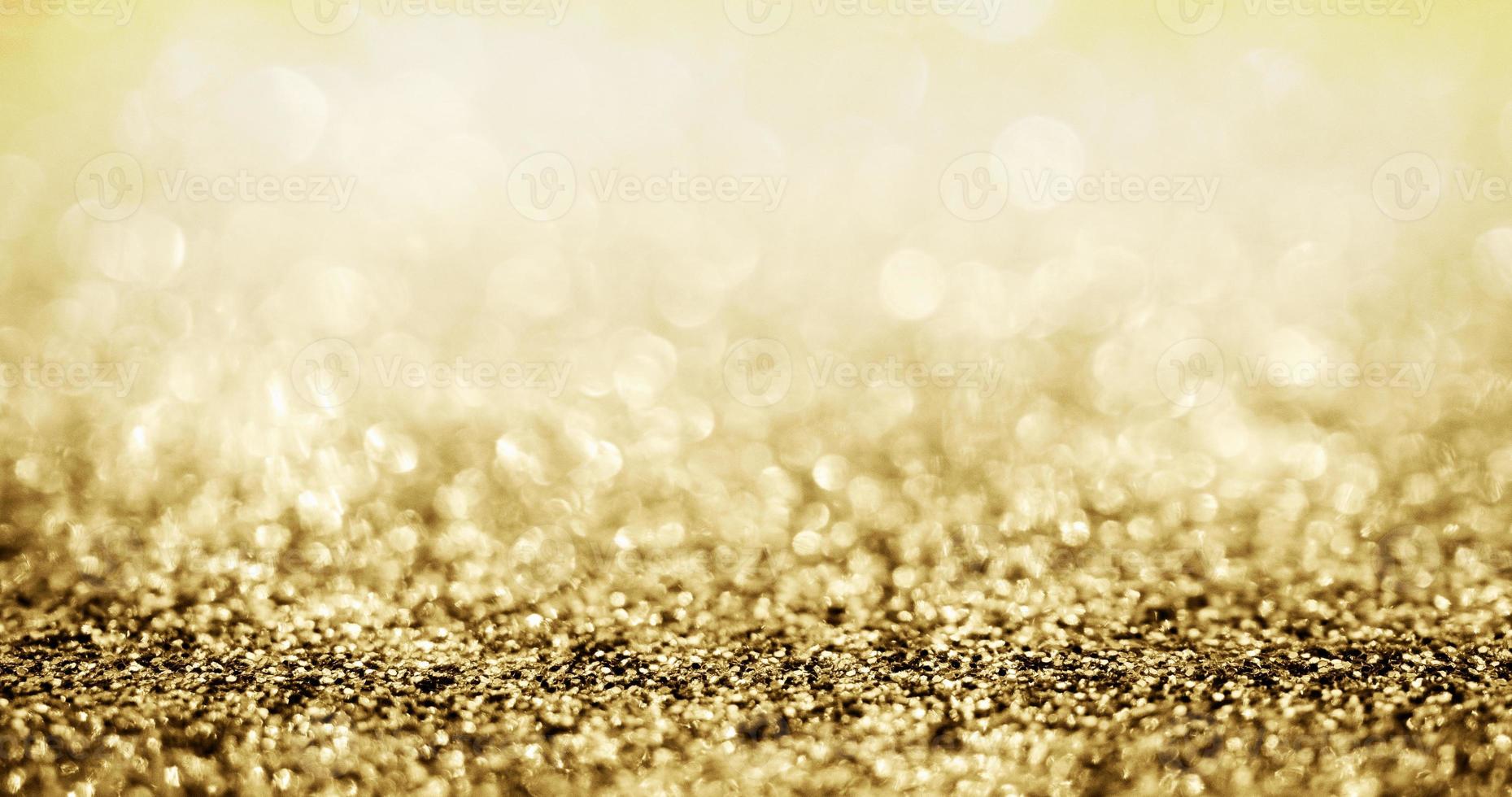 brilho de glitter dourado abstrato com fundo bokeh foto