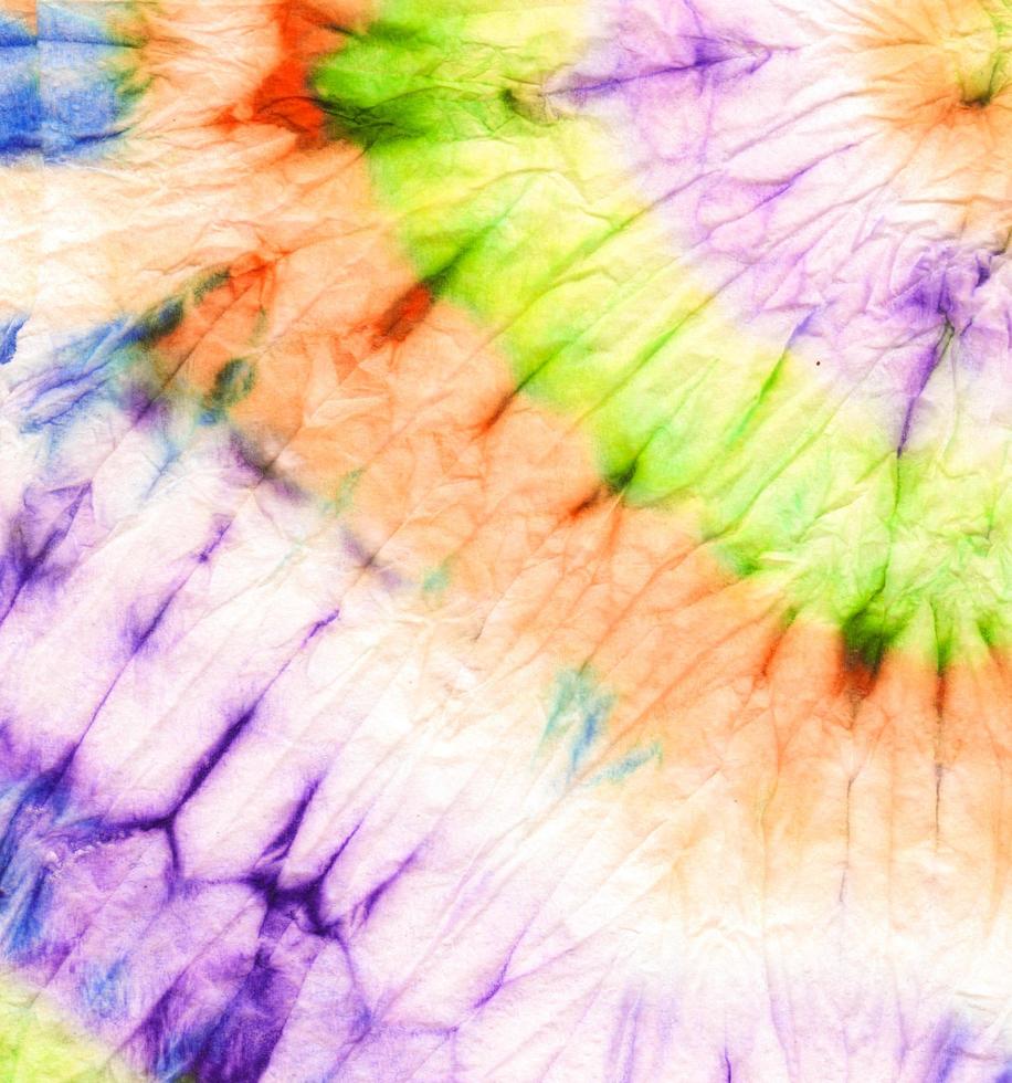 tie dye em espiral neon. morrer textura redonda. vestir foto