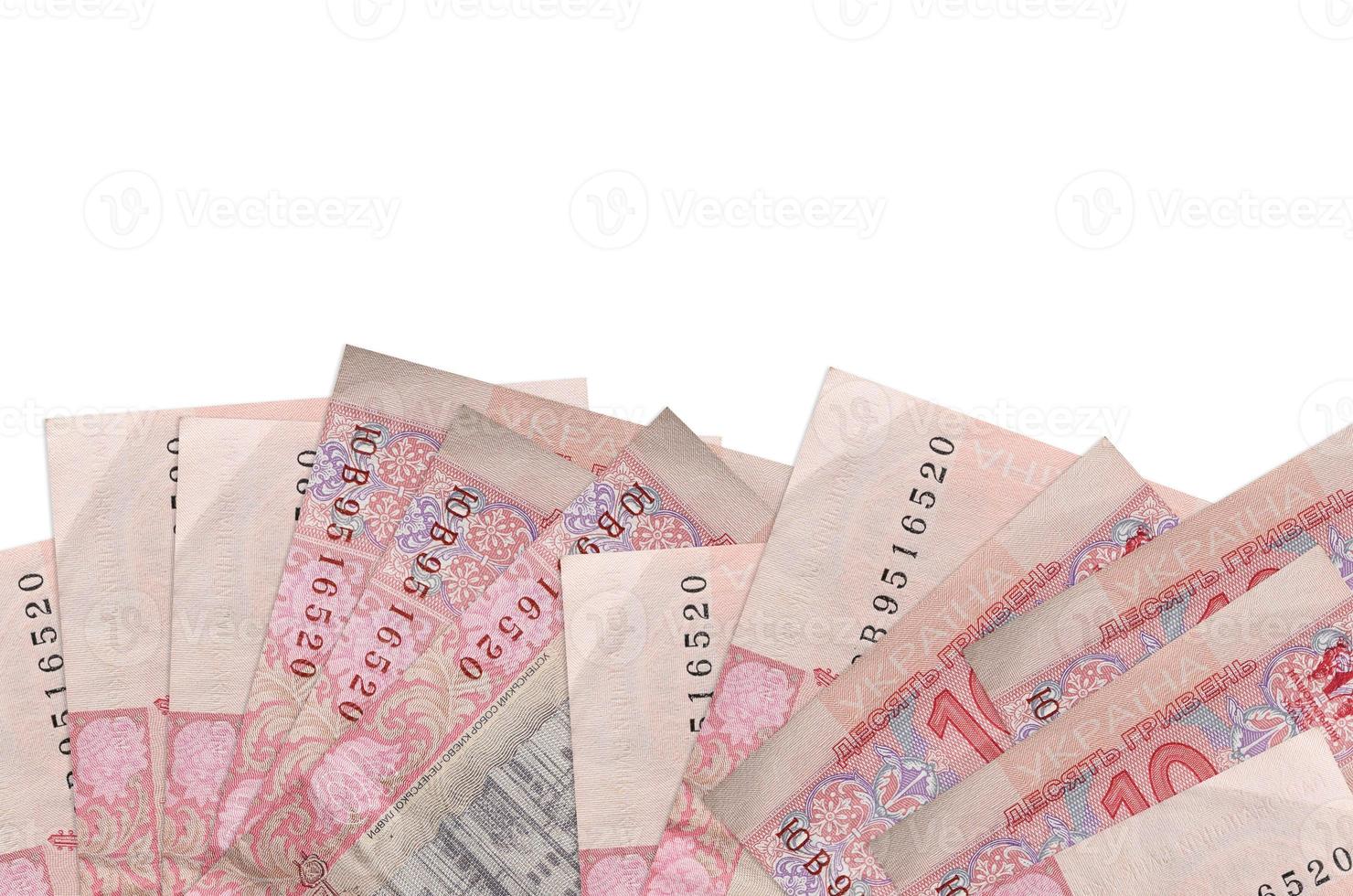 10 contas de hryvnias ucranianas encontra-se na parte inferior da tela isolada no fundo branco com espaço de cópia. modelo de banner de fundo foto