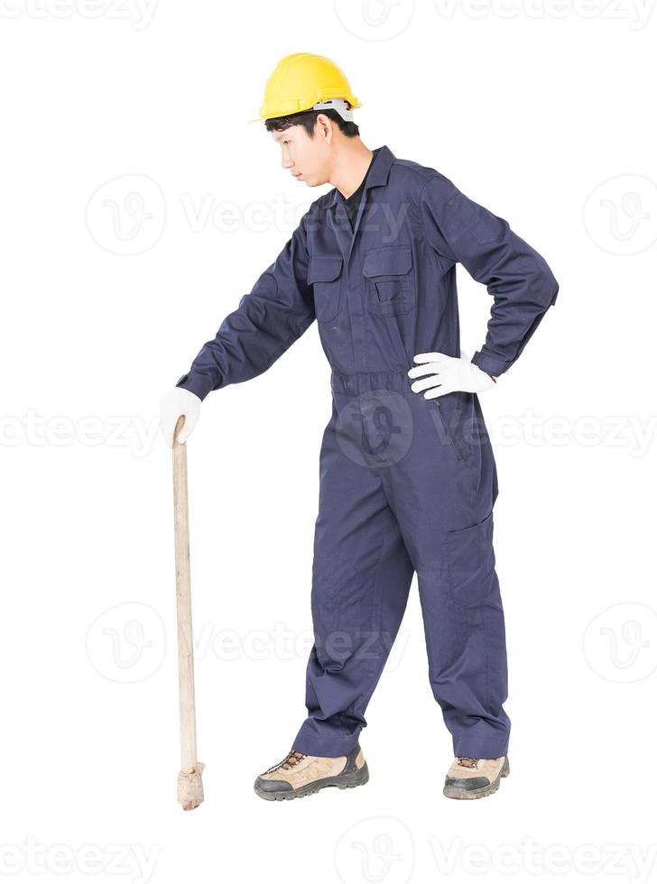 homem de uniforme segura picareta velha que é um dispositivo de mineração foto