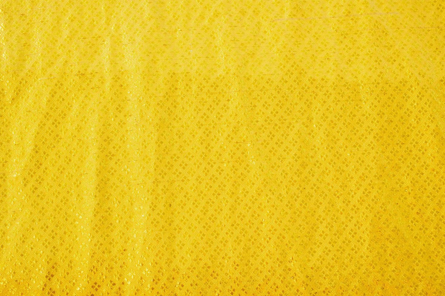 textura de gradiente de roupa de cama amarela estilo de curva turva de tecido de luxo abstrato, roupa de cama enrugada e sombras douradas, fundo foto