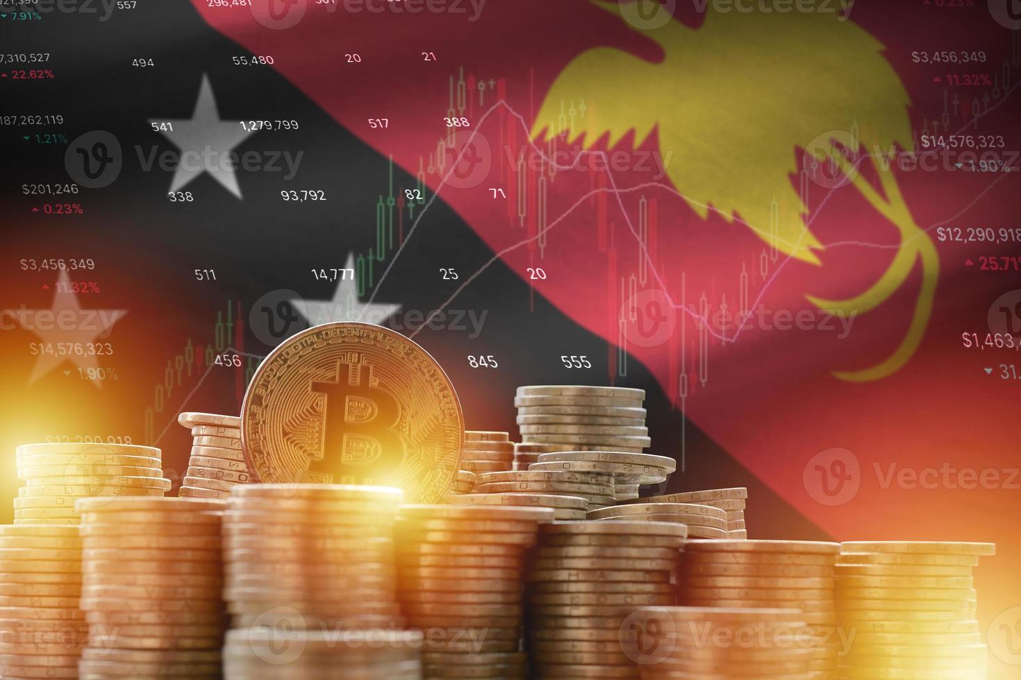 bandeira de papua nova guiné e grande quantidade de moedas bitcoin douradas e gráfico de plataforma de negociação. moeda criptográfica foto