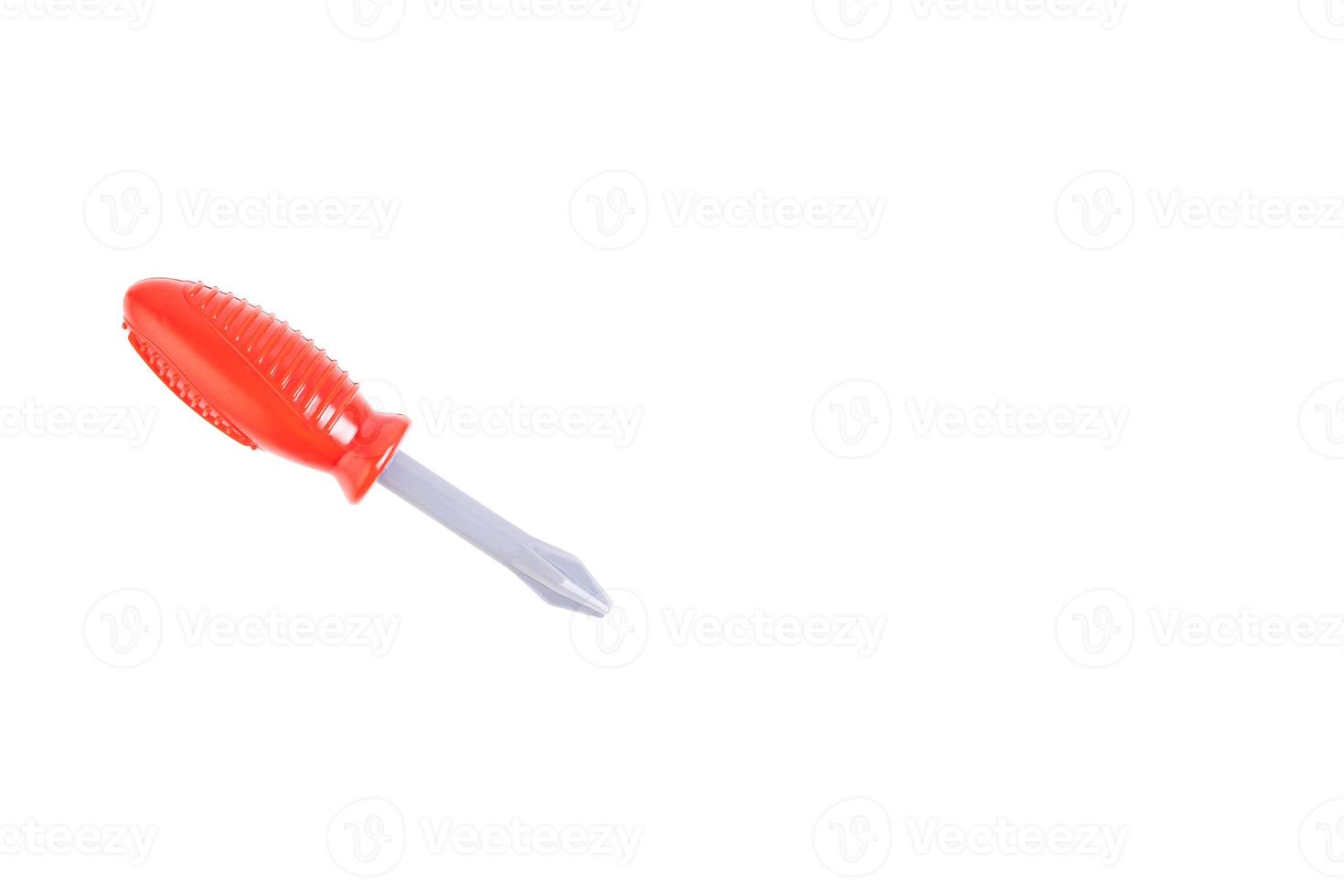 chave de fenda, chave de fenda de plástico de brinquedo com alça vermelha, ferramenta infantil. fundo branco isolado. foto