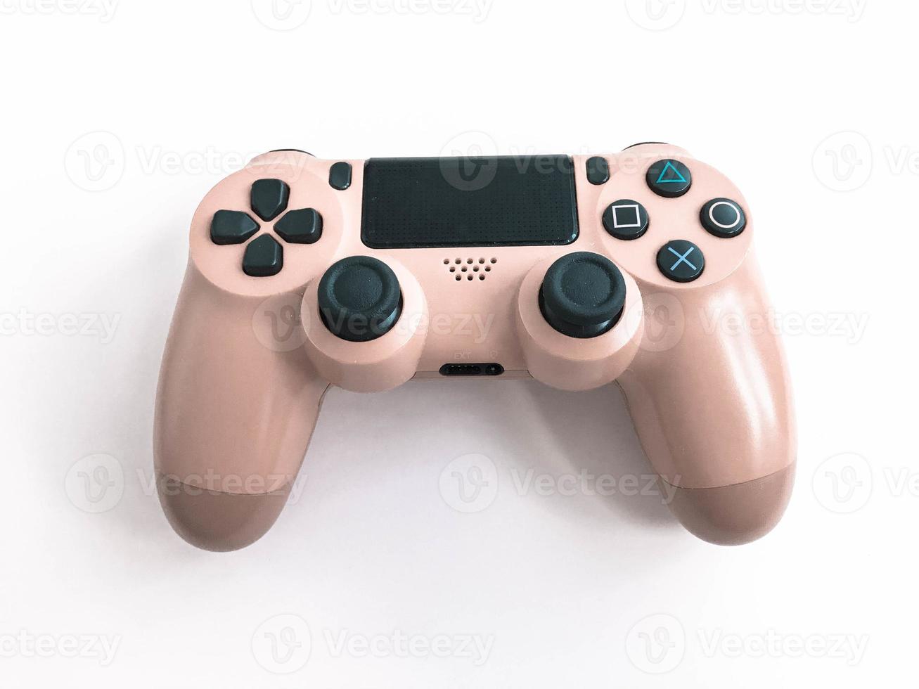 lindo novo joystick de jogo moderno digital vermelho para gamepad de videogame de computador em um fundo rosa foto