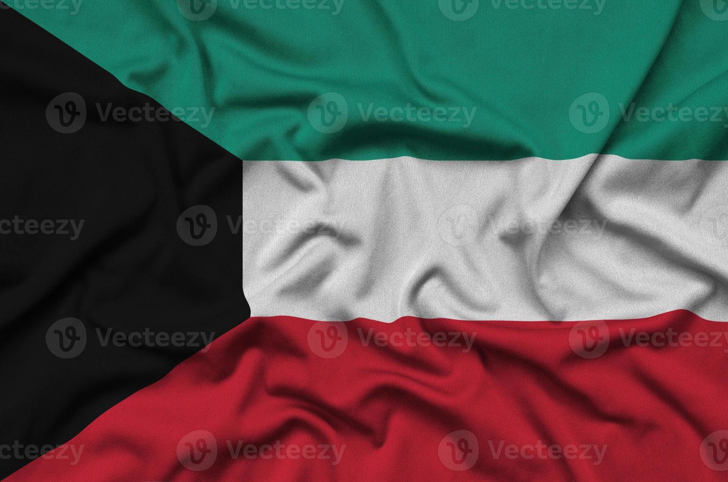 a bandeira do kuwait é retratada em um tecido esportivo com muitas dobras. bandeira da equipe esportiva foto