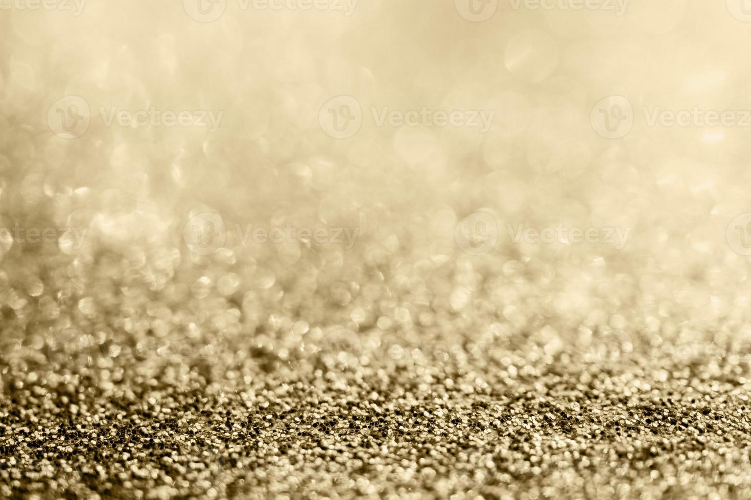 brilho de glitter dourado abstrato turva com fundo bokeh foto