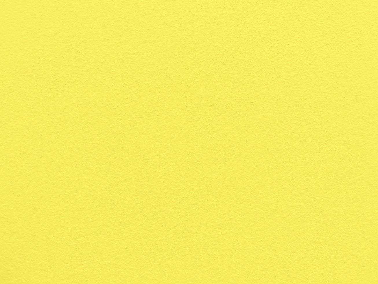 textura perfeita da parede de cimento amarelo uma superfície áspera, com espaço para texto, para um fundo. foto