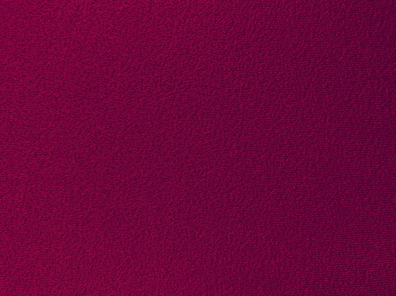 textura de tecido de algodão roxo magenta usada como plano de fundo. fundo de tecido roxo vazio de material têxtil macio e liso. há espaço para o texto.. foto