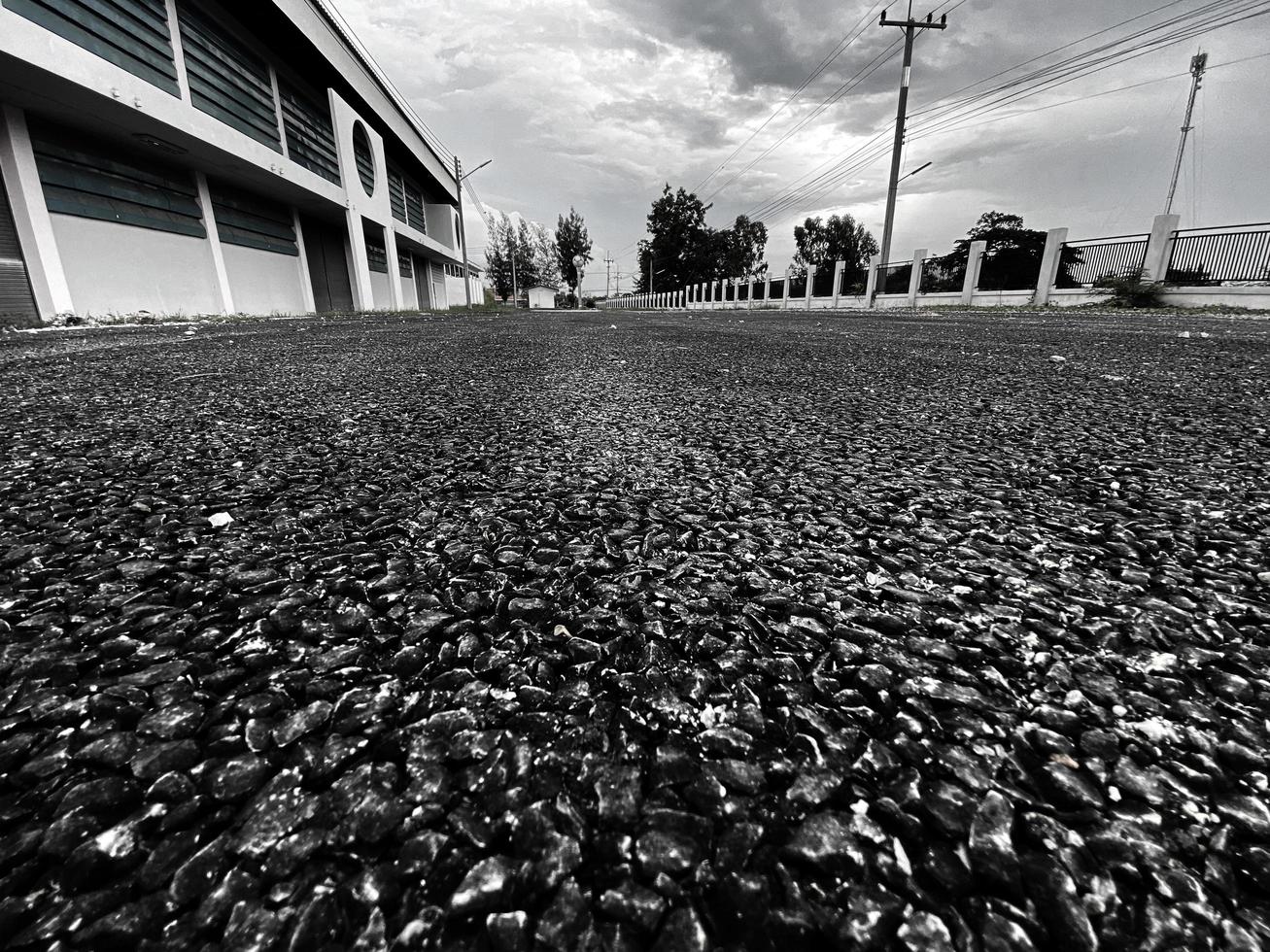 pedra de tijolo monótona no chão para estrada de rua. calçada, entrada de automóveis, pavimentadoras, pavimento em fundo de textura de padrão de pedra de piso de design vintage foto