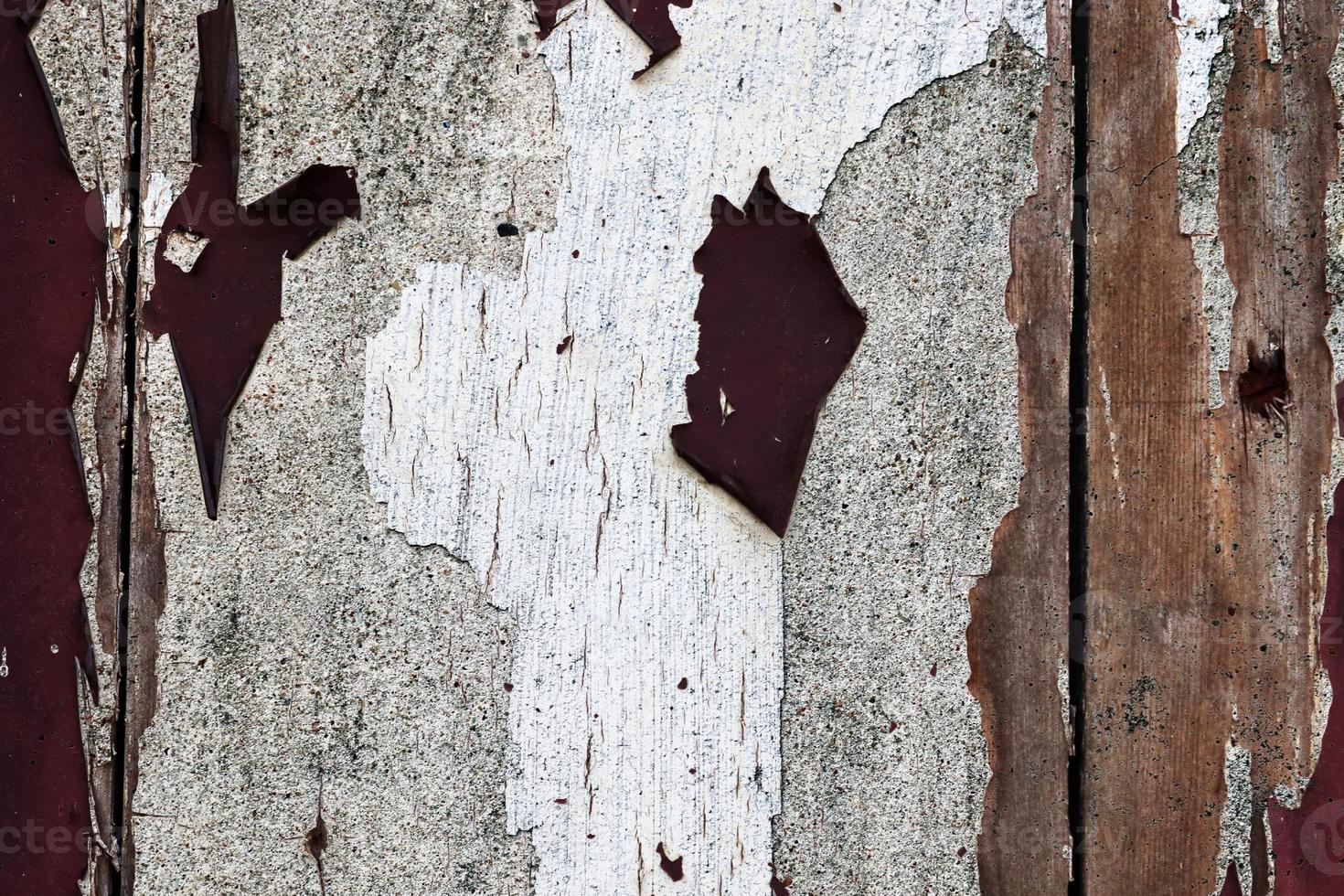 detalhado e colorido close-up em tinta rachada e descascada em texturas de parede de concreto em alta resolução foto