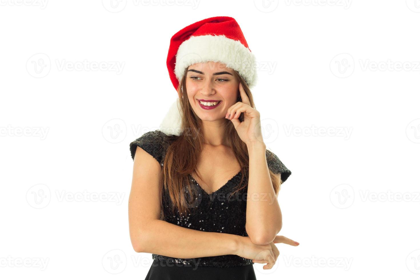 atraente garota feliz com chapéu de Papai Noel foto