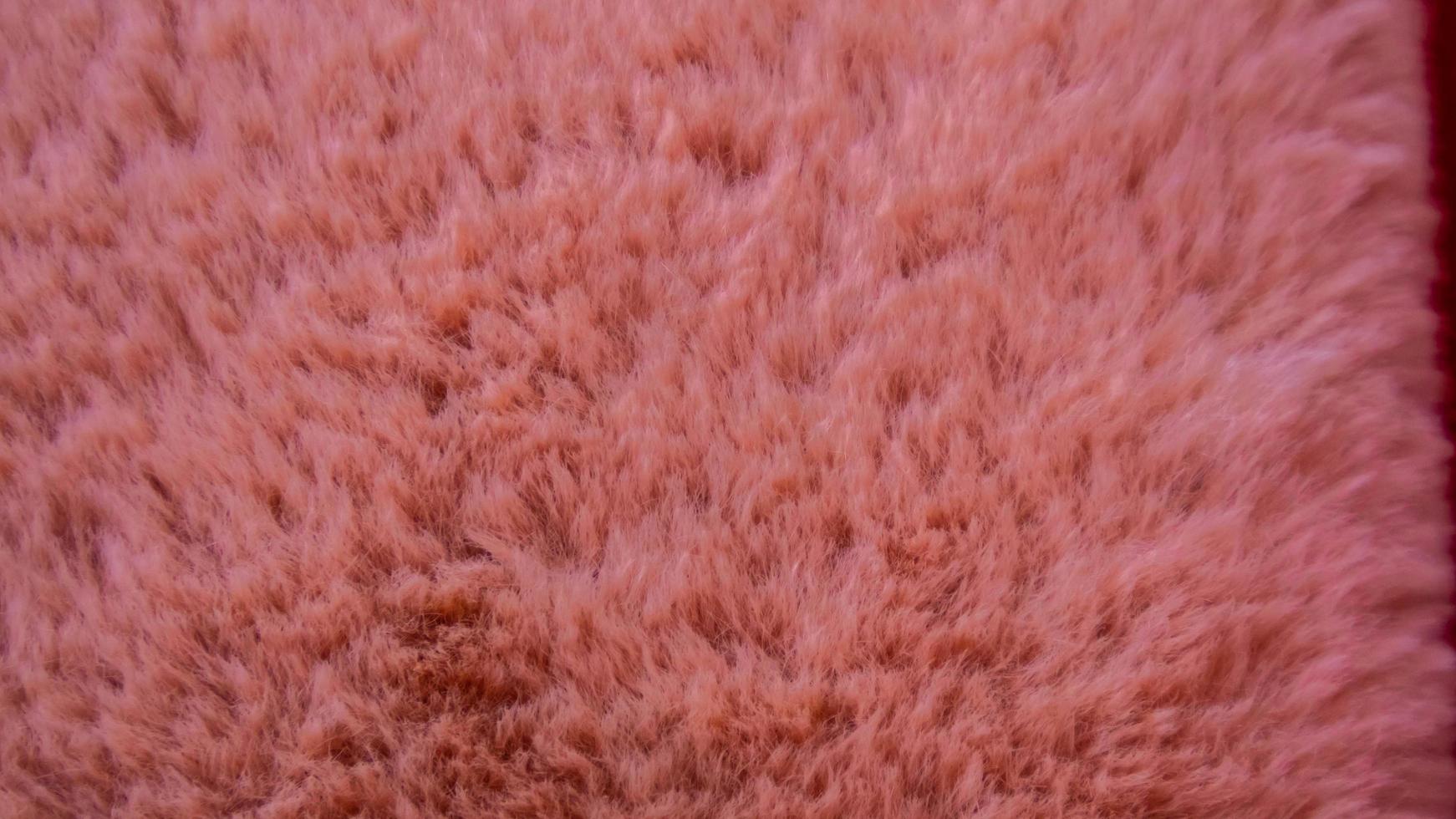 textura de lã rosa como pano de fundo foto