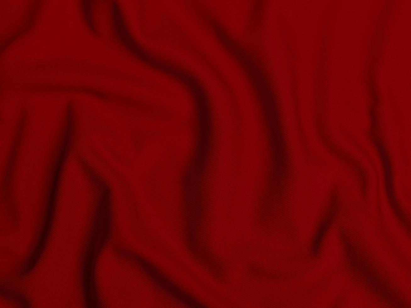 textura de tecido de veludo vermelho usada como plano de fundo. fundo de tecido vermelho vazio de material têxtil macio e liso. há espaço para o texto. foto