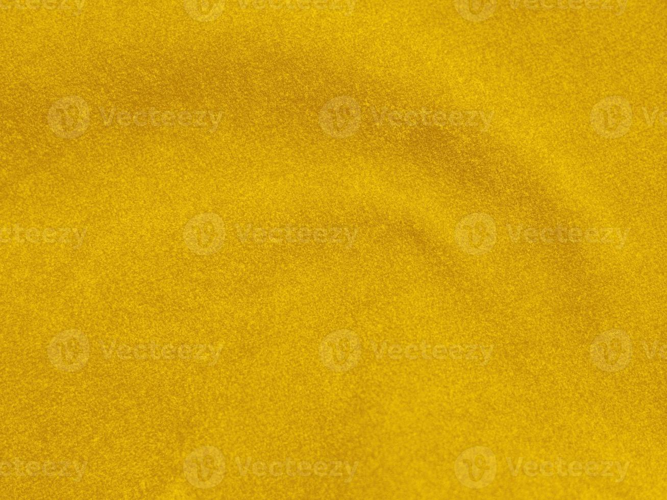 textura de tecido de veludo amarelo usada como plano de fundo. fundo de tecido amarelo vazio de material têxtil macio e liso. há espaço para texto foto